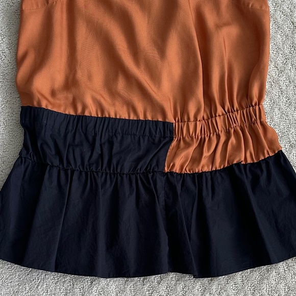 Tibi Sleeveless Color-Blocked Peplum Top Black/Burnt Orange Modern Classic 2 - Picture 3 of 12